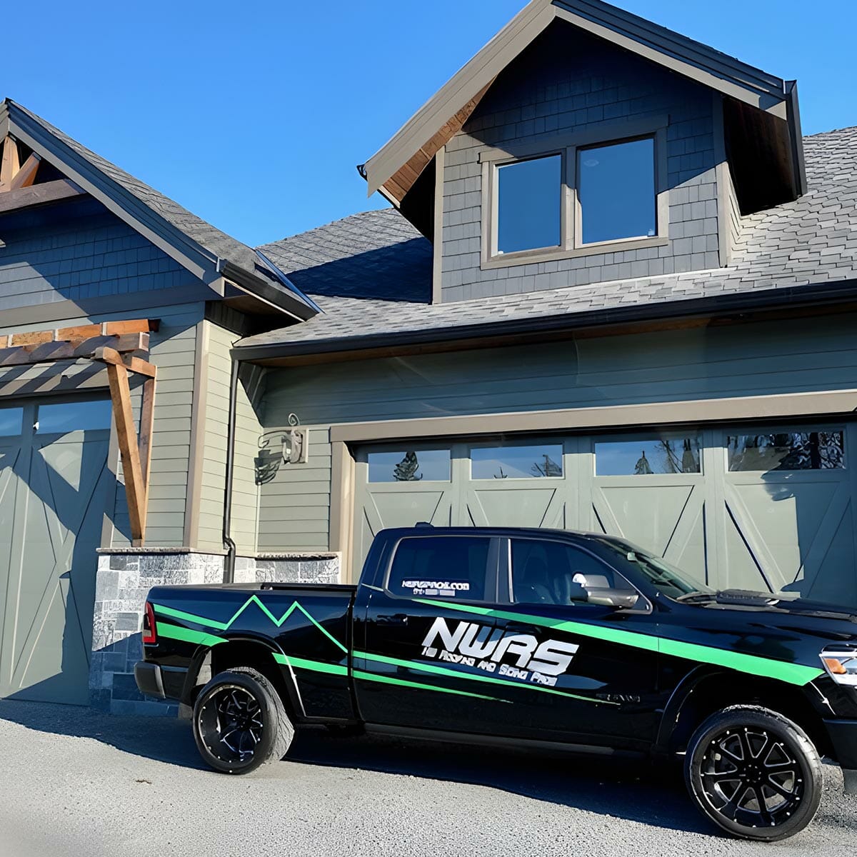 Close-up of house siding and garage door